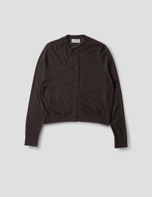 Dark brown merino cardigan with fully fashioned sleeves, horn buttons on concealed placket finished with grosgrain, and ribbed neck, cuffs and hem. Front flat lay view.