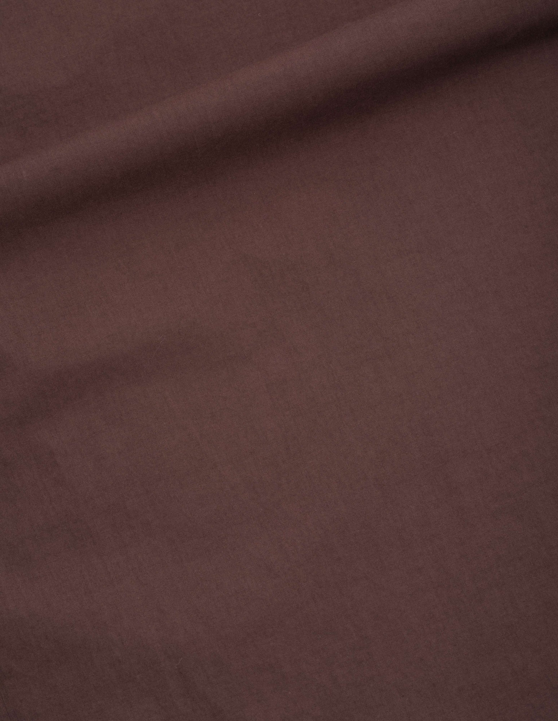 Brown fine count cotton poplin dress fabric swatch.