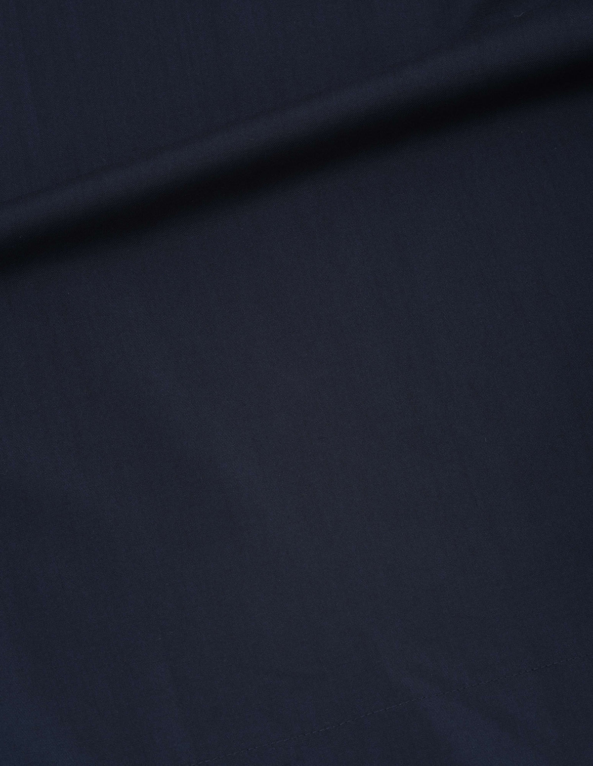 Dark blue fluid wool plainweave dress fabric swatch.