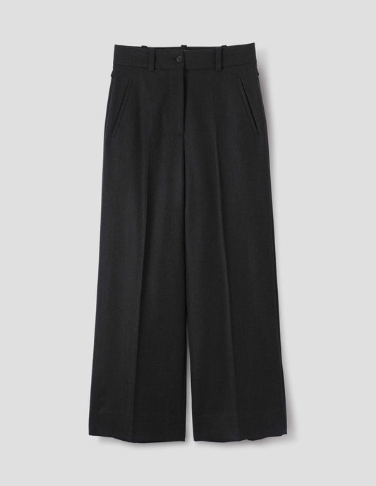 Black wool trousers with dark grey stripes, belt loops on wide waistband, zip fly and horn button fastening, side adjusters and slanted front welt pockets. Front flat lay view.