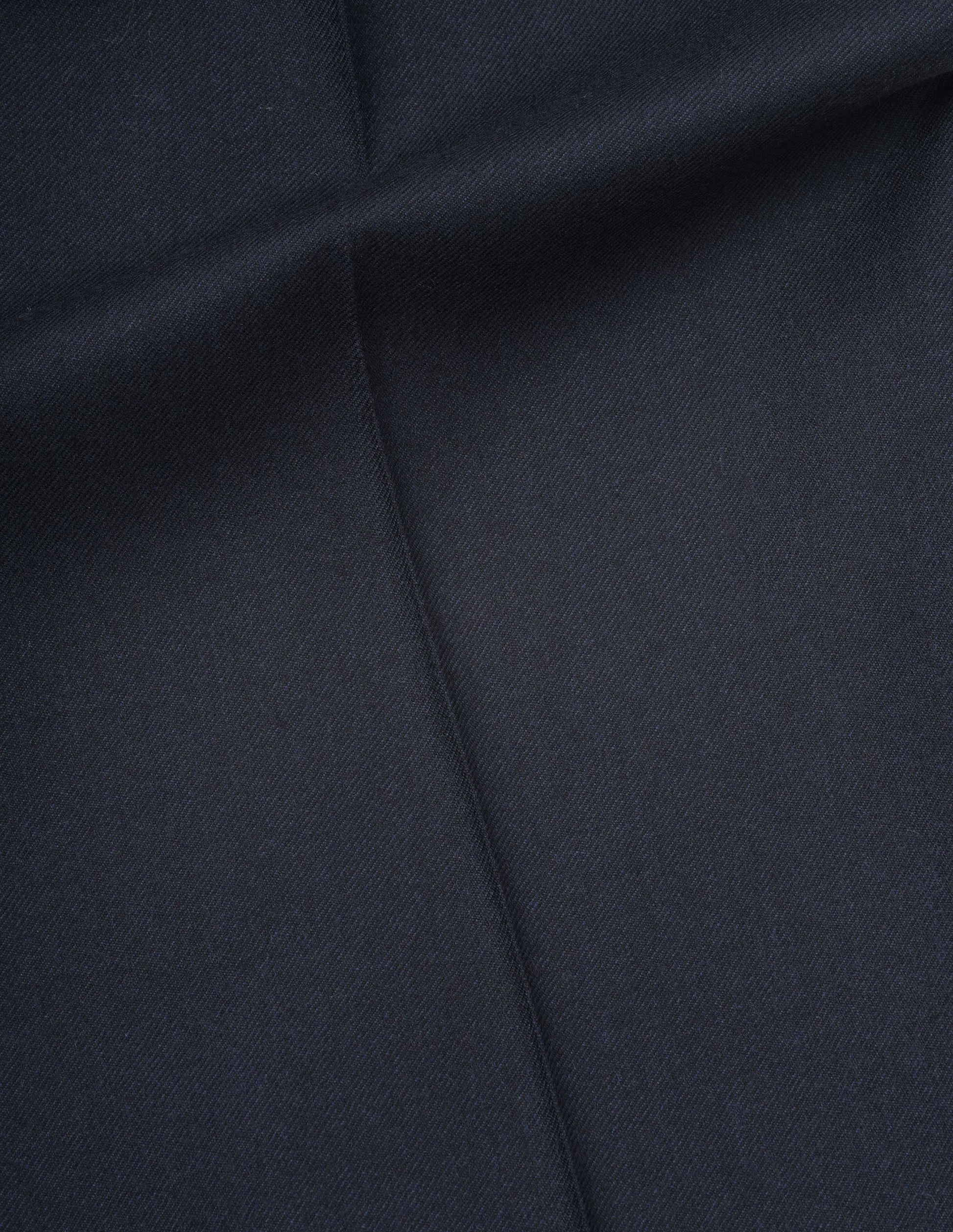 Dark blue washed serge wool trousers fabric swatch.