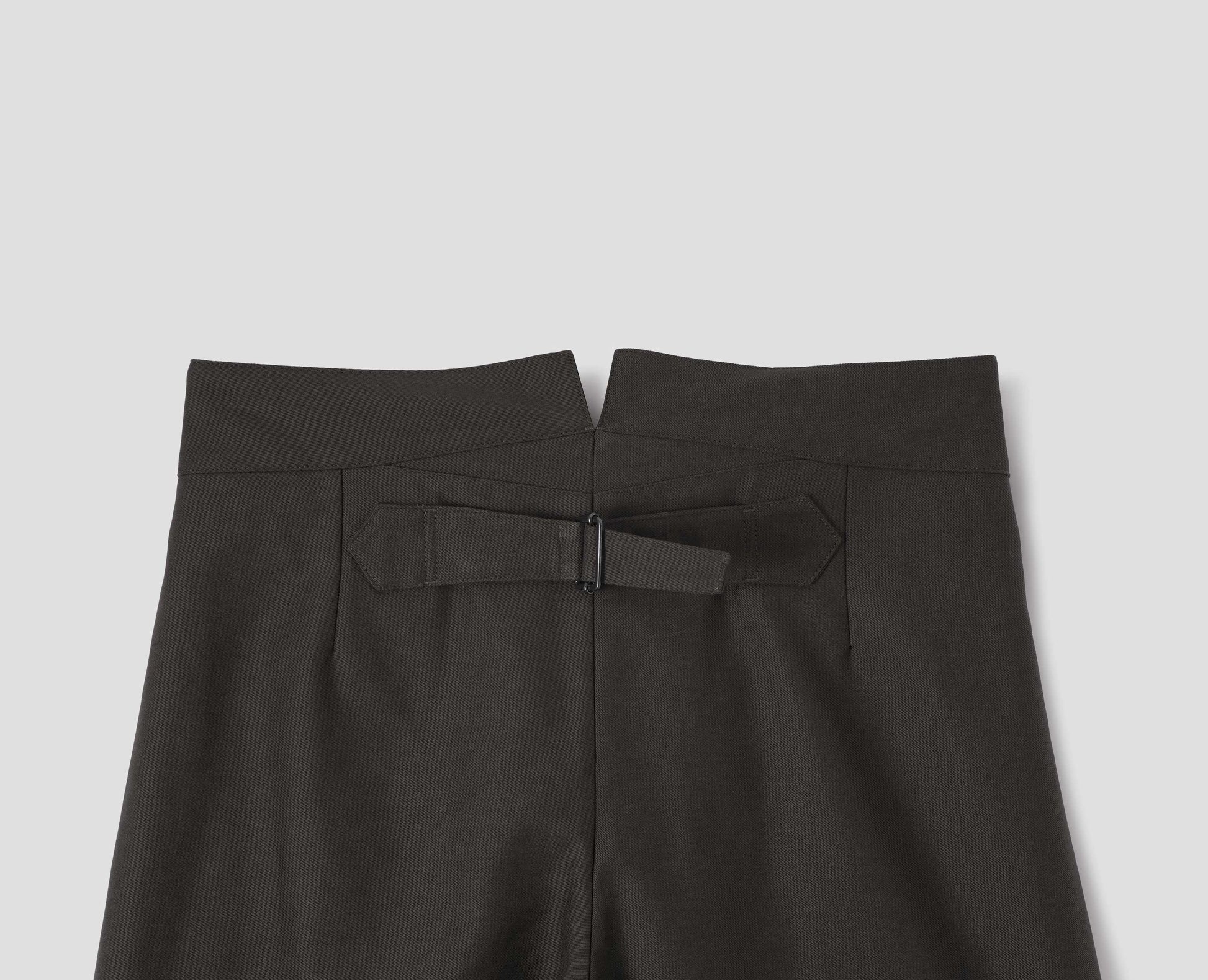 Grey cotton trousers with back cinch. Back flat lay view.