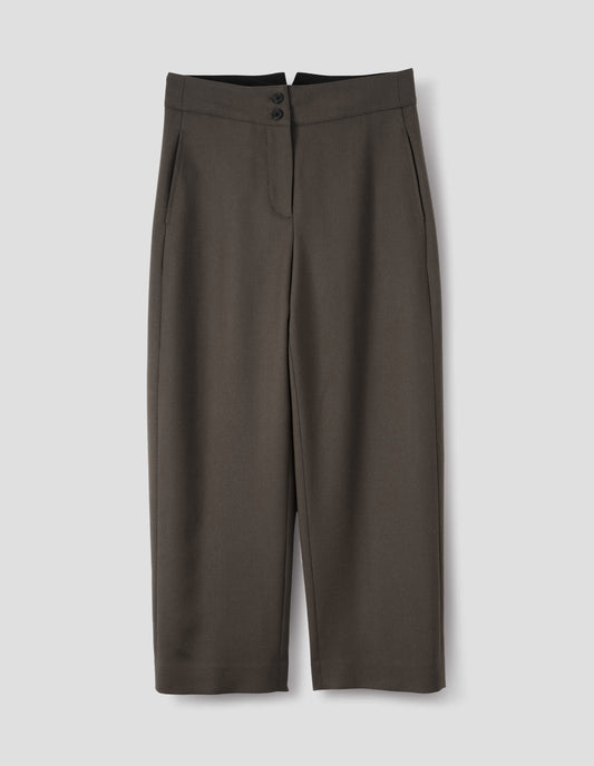 Brown wool trousers with double horn button fastening and concealed side pockets with stitch detailing. Front flat lay view