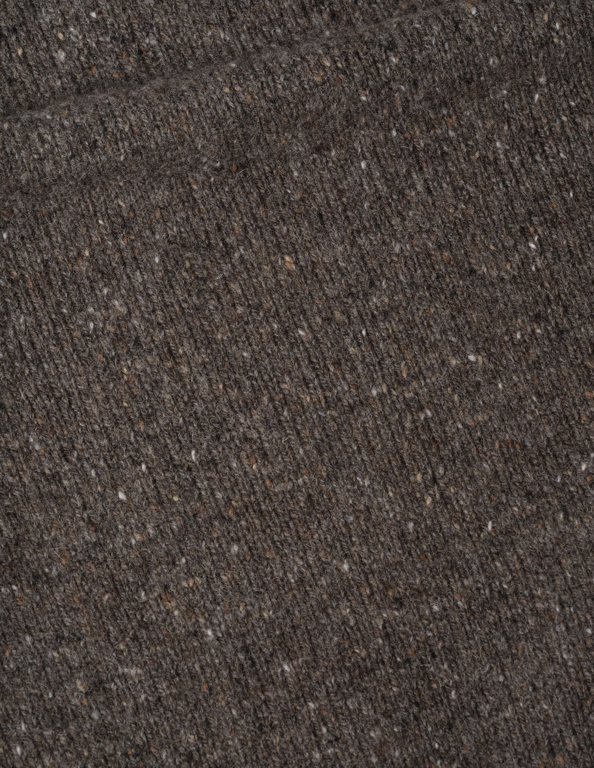 Brown soft donegal wool jumper fabric swatch.