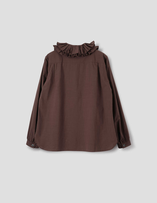 Brown cotton shirt with double ruffle collar, bracelet-length sleeves with mother of pearl buttons on narrow, gathered cuffs, and with curved hem. Back flat lay view.