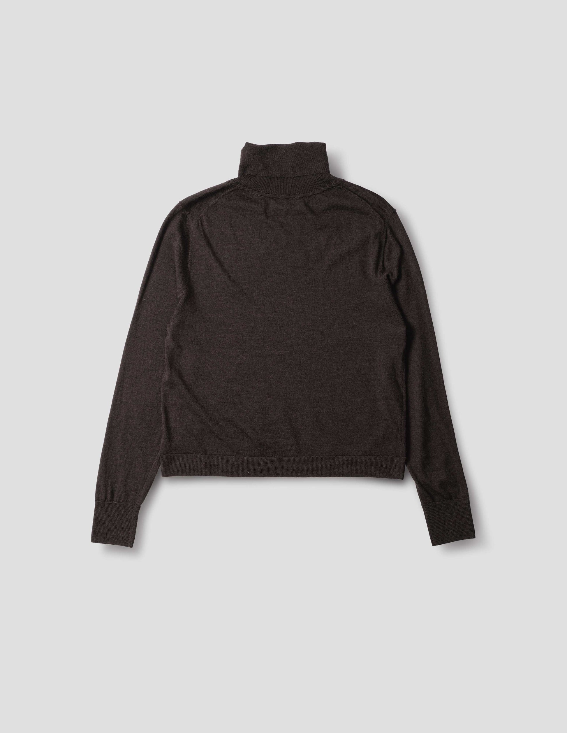 Dark brown merino knitted top with fully fashioned roll neck and armhole, and with ribbed neck, sleeves, cuff and hem. Back flat lay view.