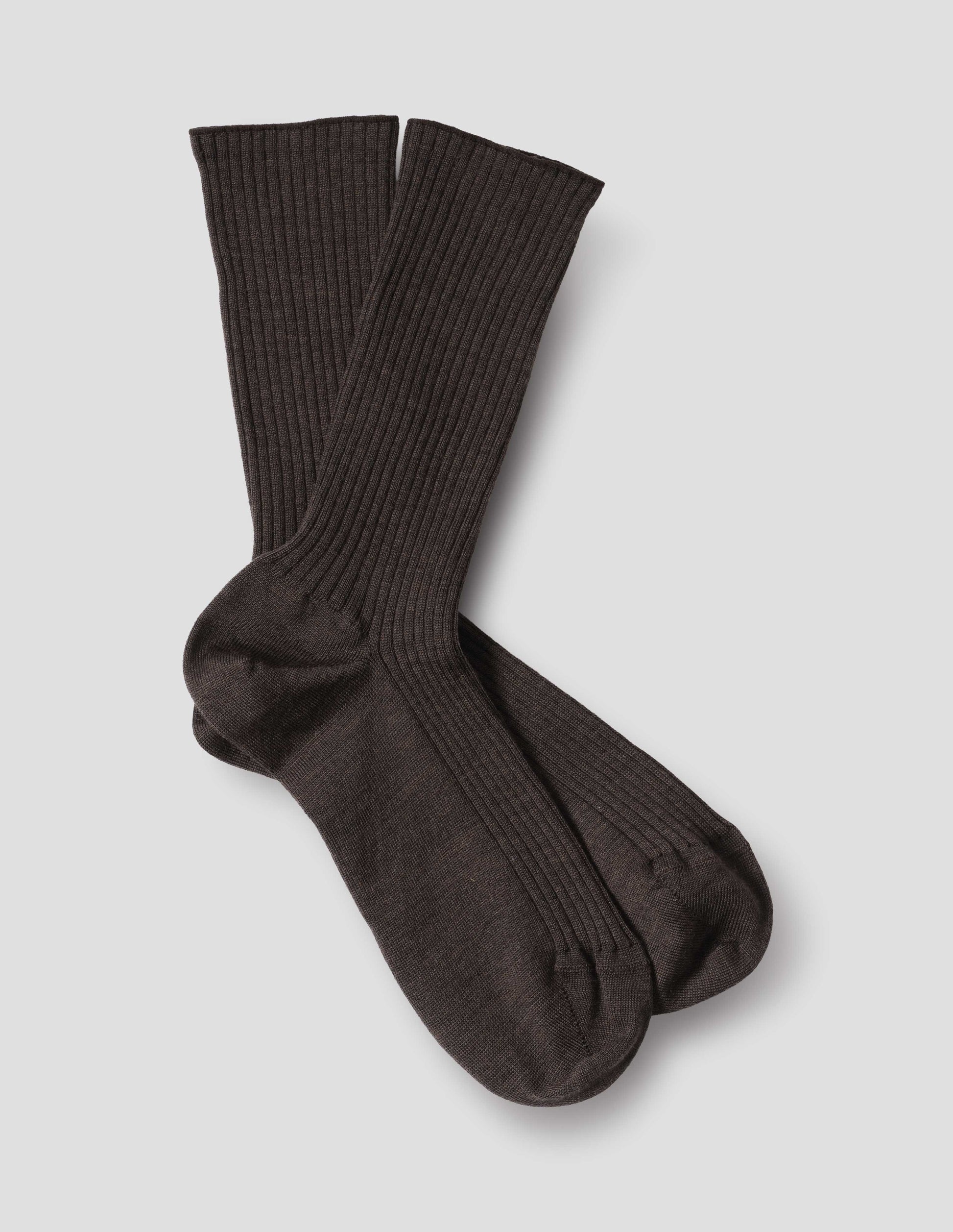Dark brown wool socks, ribbed, front flat lay view.