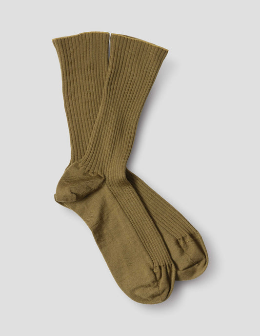Yellowish green wool socks, ribbed, front flat lay view.