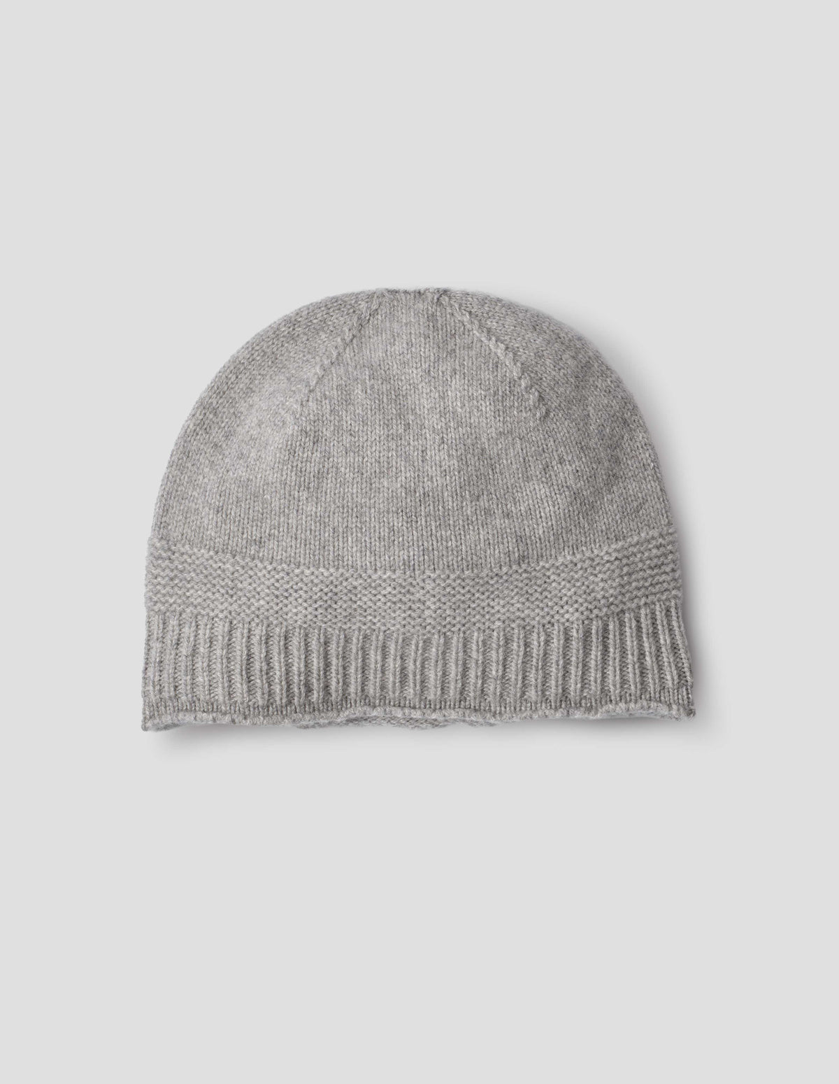 Grey merino cashmere knitted beanie with contrasting garter stitch and rib bands. Front flat lay view.