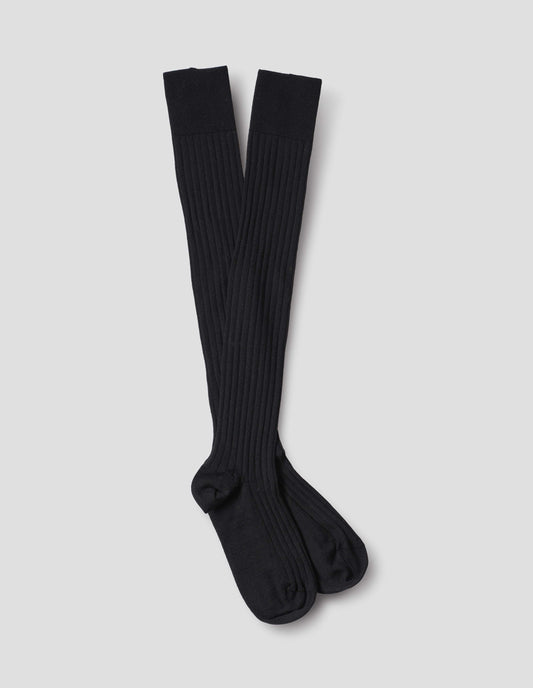 Black wool socks, long and ribbed, front flat lay view.