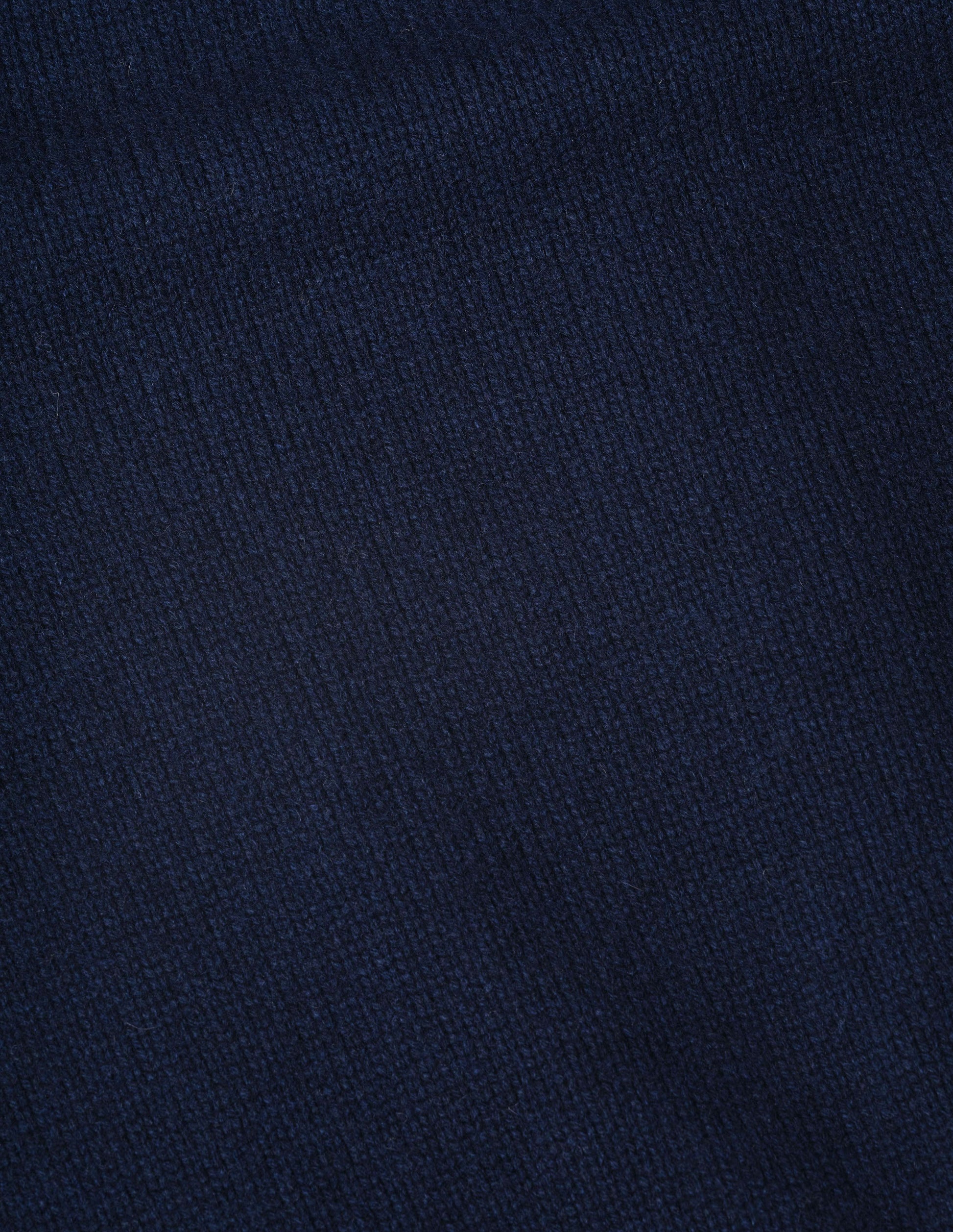 Dark blue cashmere merino knitted gilet fabric swatch.