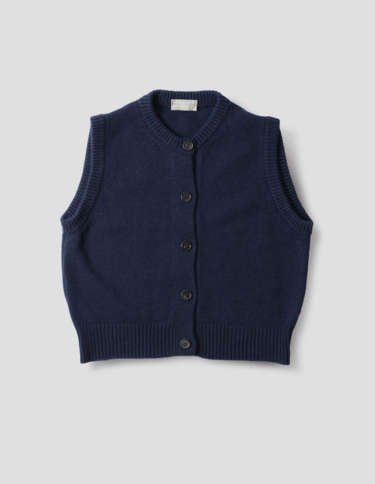 Dark blue cashmere merino knitted gilet with horn buttons on Milano stitch placket, rib detailing at neck, armholes and hem. Front flat lay view.