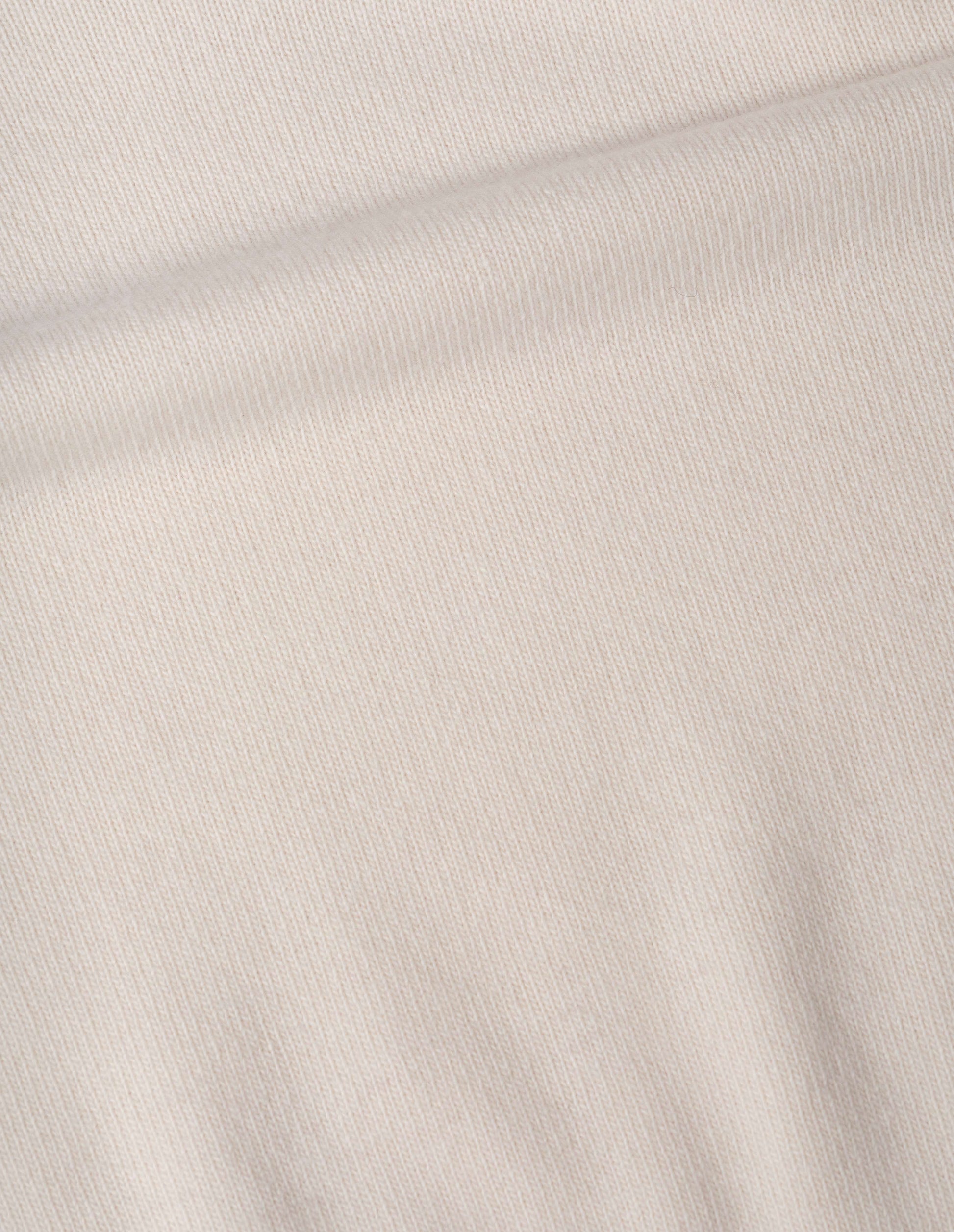 Light beige soft spun wool jumper fabric swatch.