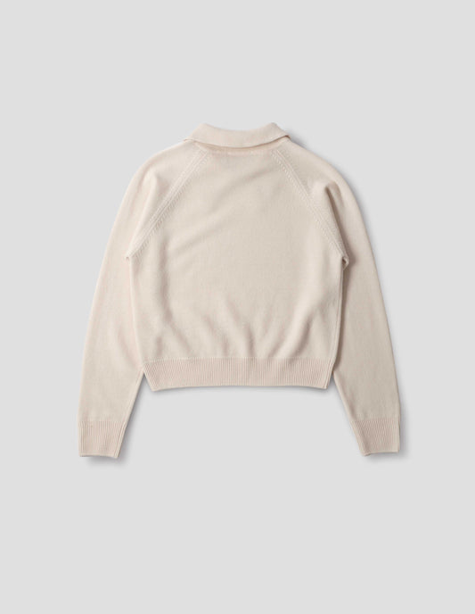 Light beige merino jumper with collar, raglan sleeves, ribbed cuffs and hem. Back flat lay view.