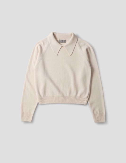 Light beige merino jumper with exaggerated collar, raglan sleeves, ribbed cuffs and hem. Front flat lay view.
