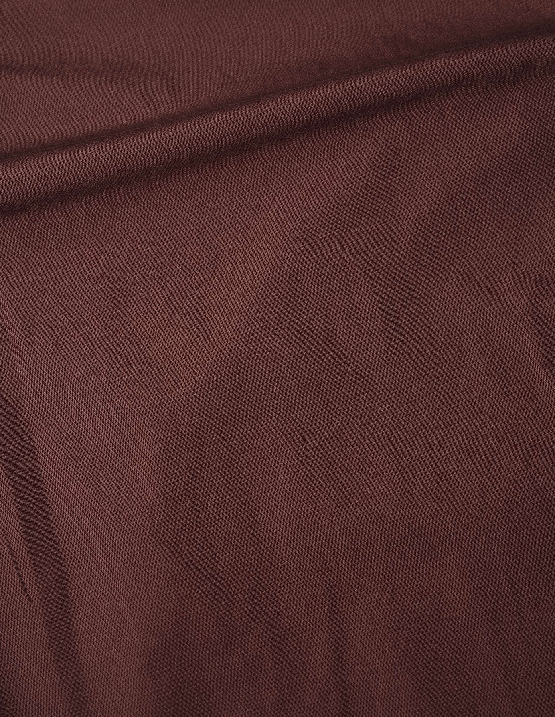 Brown washed cotton poplin asymmetric round collar shirt, fabric swatch.