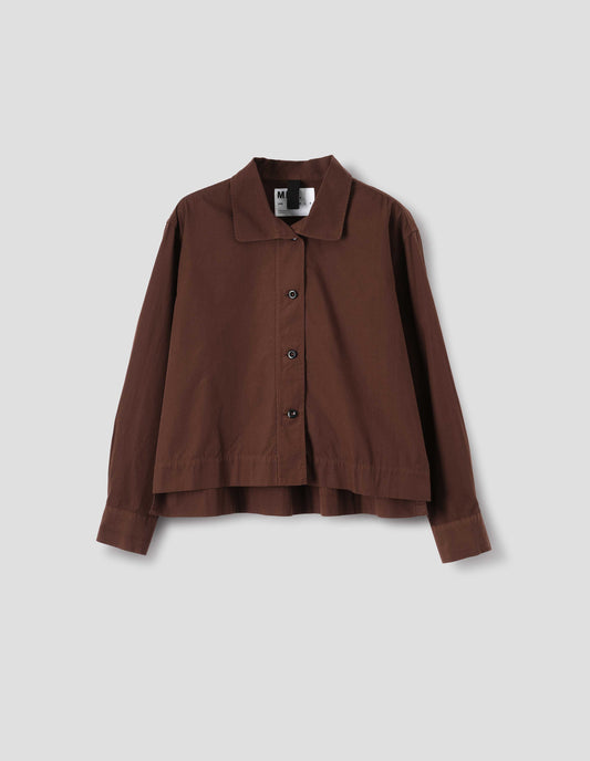 Brown cotton shirt, with  asymmetric collar and brown buttons, front flat lay view.