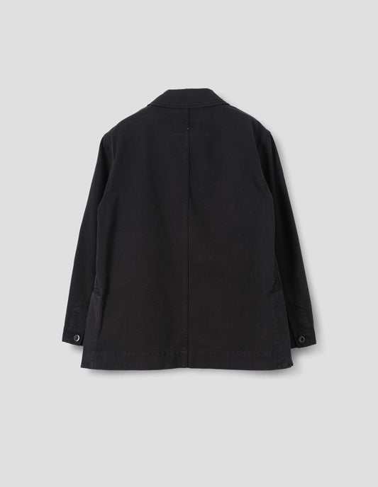 Black cotton blazer with centre back seam detailing, deep side split vents and grown-on cuffs, back flat lay view.