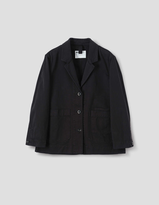 Black cotton blazer with a low breakpoint and three button closure, a wide placket, big front patch pocket with a double pocket detail and grown-on cuffs, front flat lay view.