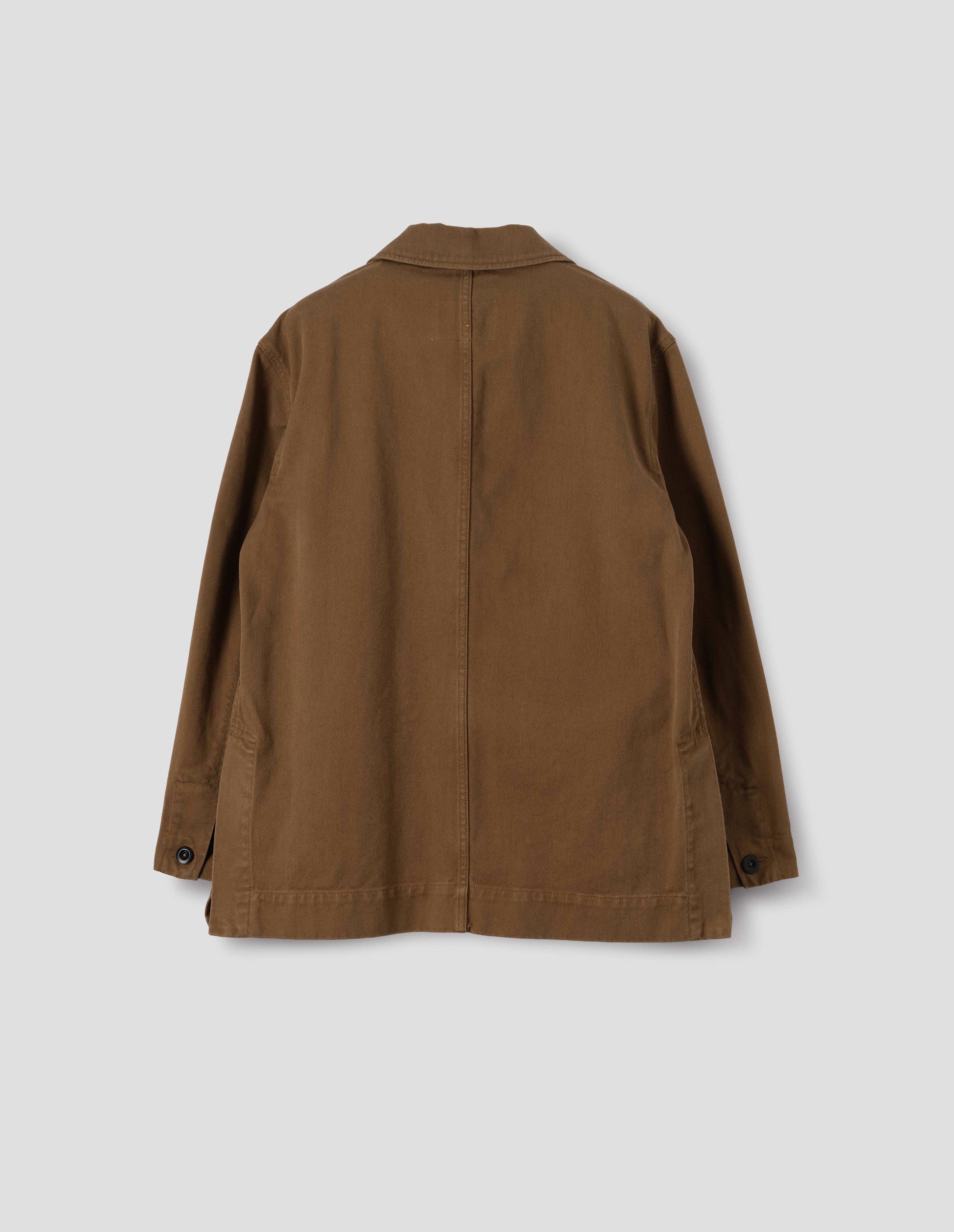 Brown cotton blazer, with a dark brown button securing each cuff, back flat lay view.