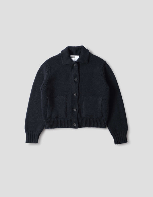 Dark navy blue boxy fit collared cardigan, with laid-on side entry pockets, and rib detailing on collar, placket, hem and cuffs, front flat lay view.