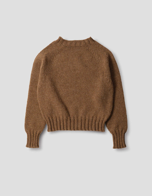 Orangey brown wool crew neck jumper with saddle sleeves and contrasting rib on the neck, cuffs and hem. Back flat lay view.