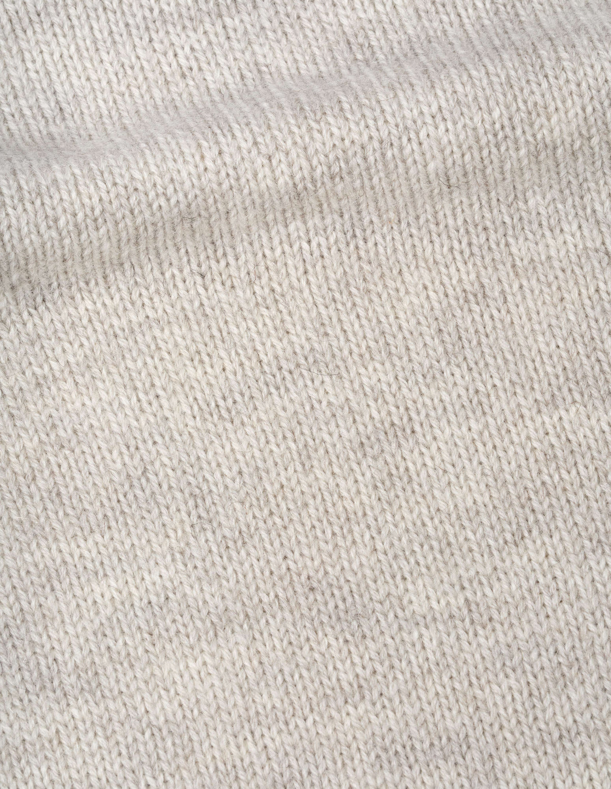 Greyish light beige wool chunky wool sweater, fabric swatch.