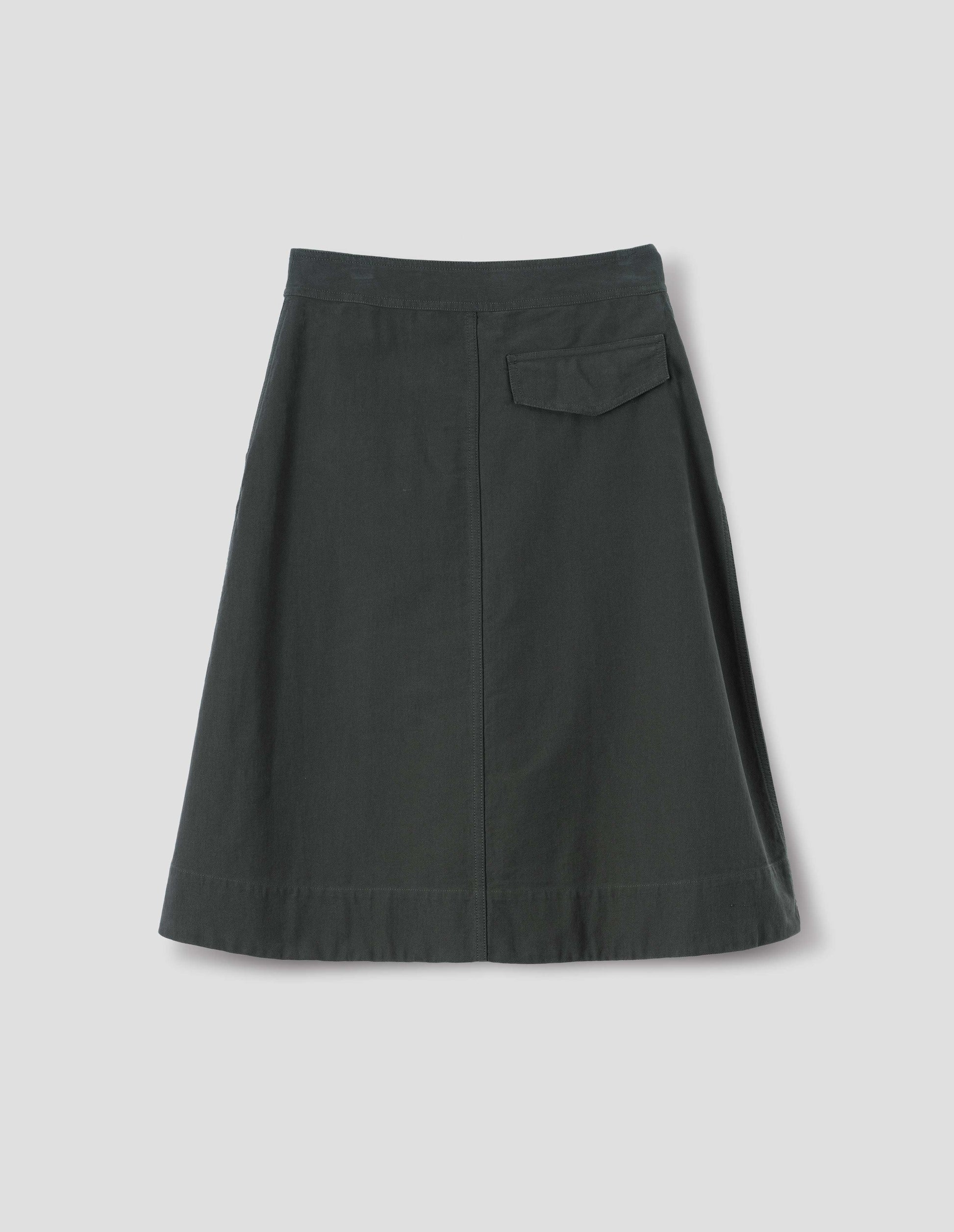 Dark green cotton skirt, with back flap pocket, back flat lay view.