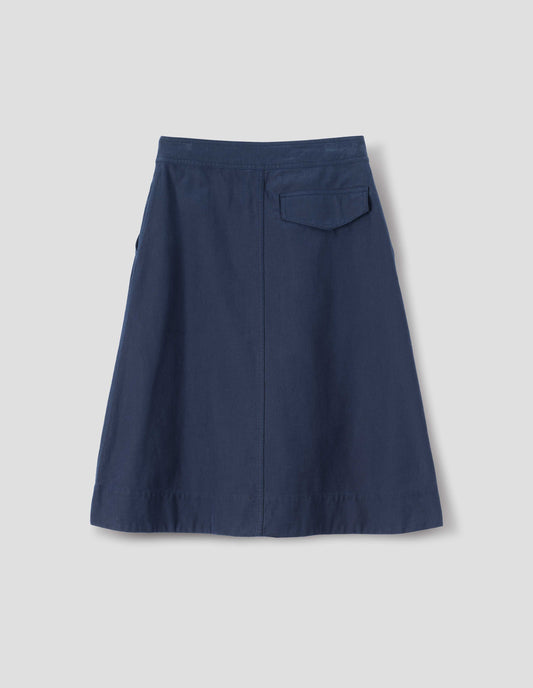 Dark blue cotton skirt, with back flap pocket, back flat lay view.