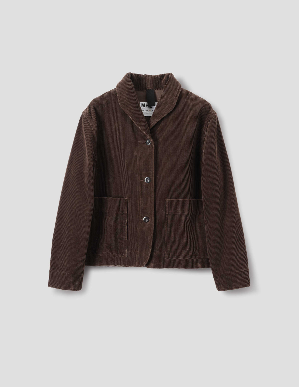 Brown corduroy jacket with a one piece collar, a dropped shoulder, stitch-through placket and large patch pockets, front flat lay view.