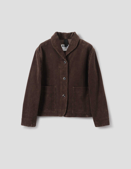 Brown corduroy jacket with a one piece collar, a dropped shoulder, stitch-through placket and large patch pockets, front flat lay view.