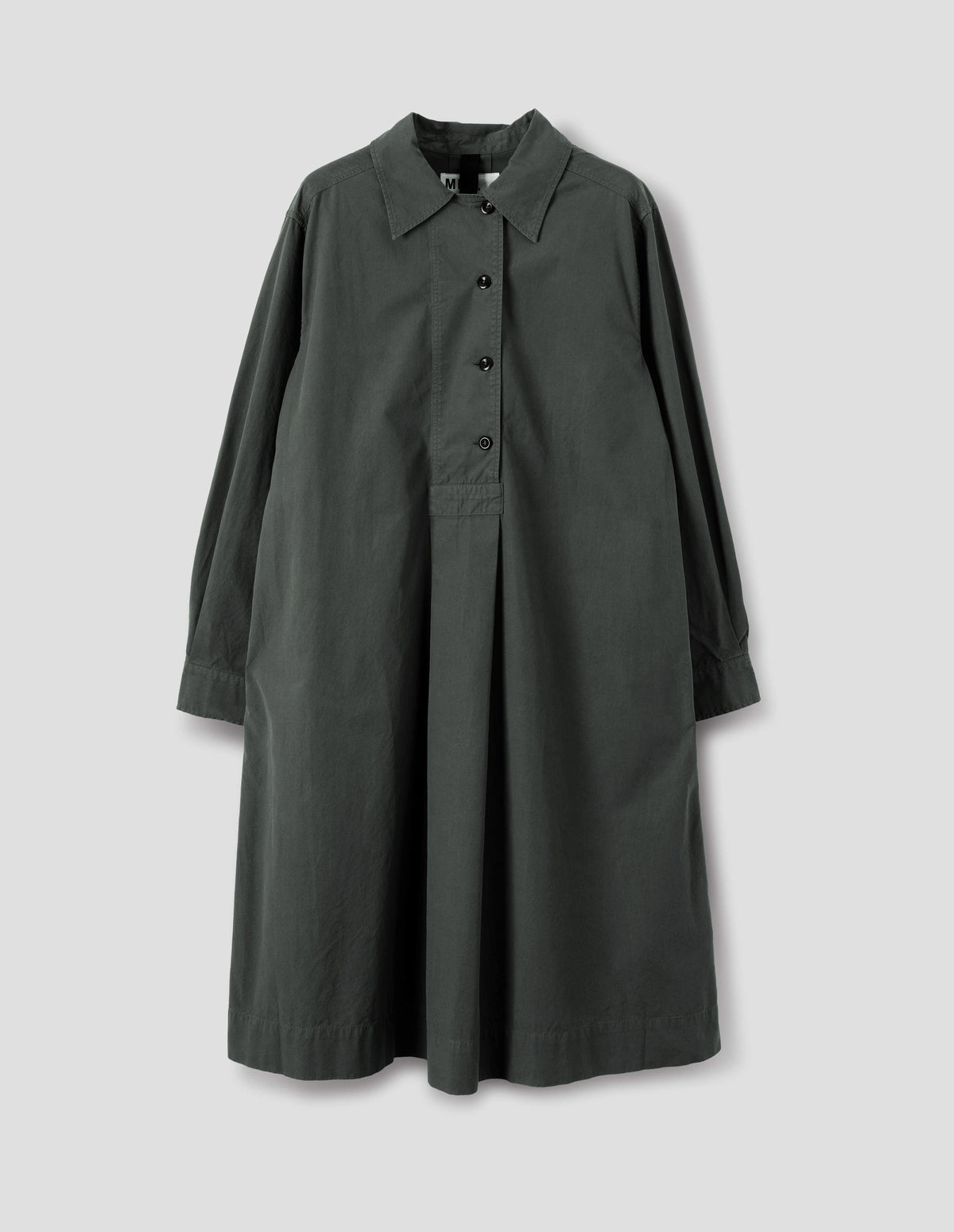 Dark grey mid length pull on cotton dress with a wide offset button placket, a box pleat skirt, side seam pockets and double pleat shirt cuffs, front flat lay view.