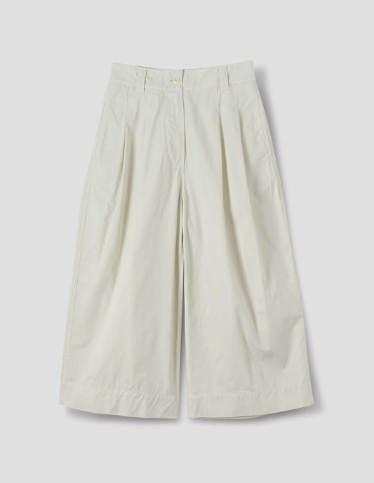 Off white cotton culottes, with front pleats, a white button and belt loops, front flat lay view.