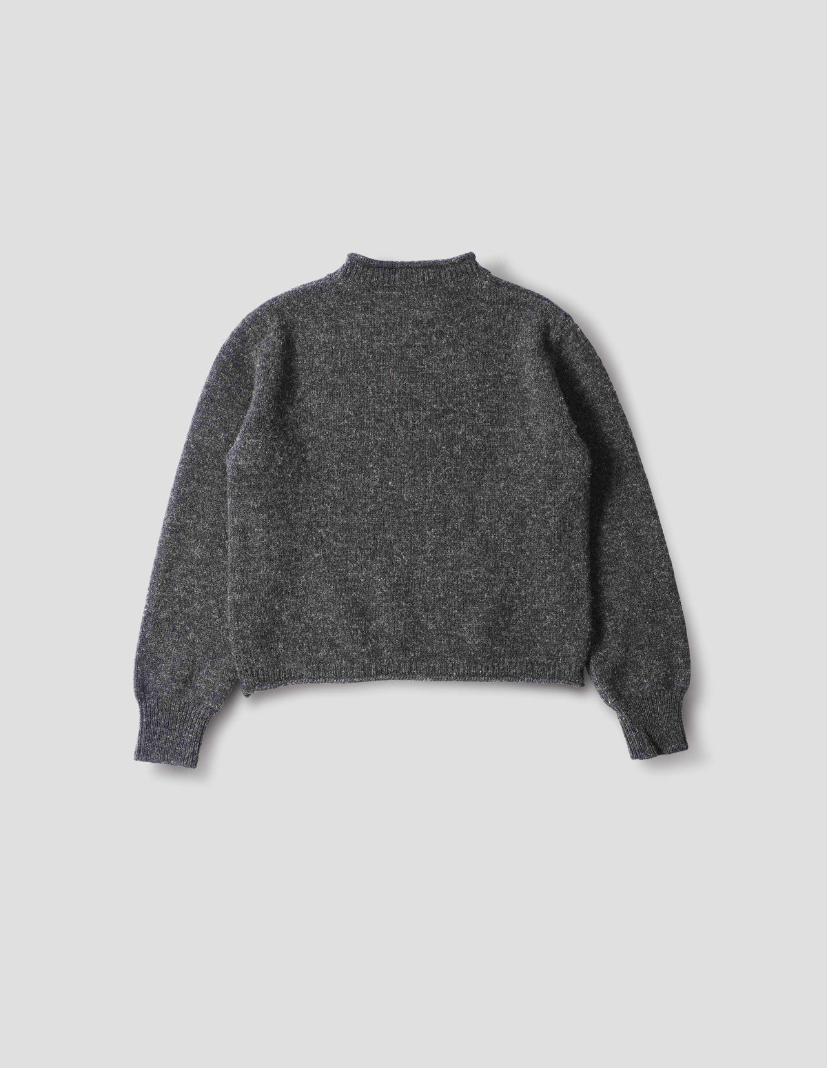 Dark grey wool crew neck jumper with a rolled edge on neck and hem, rib detailing on cuffs. Back flat lay view. 
