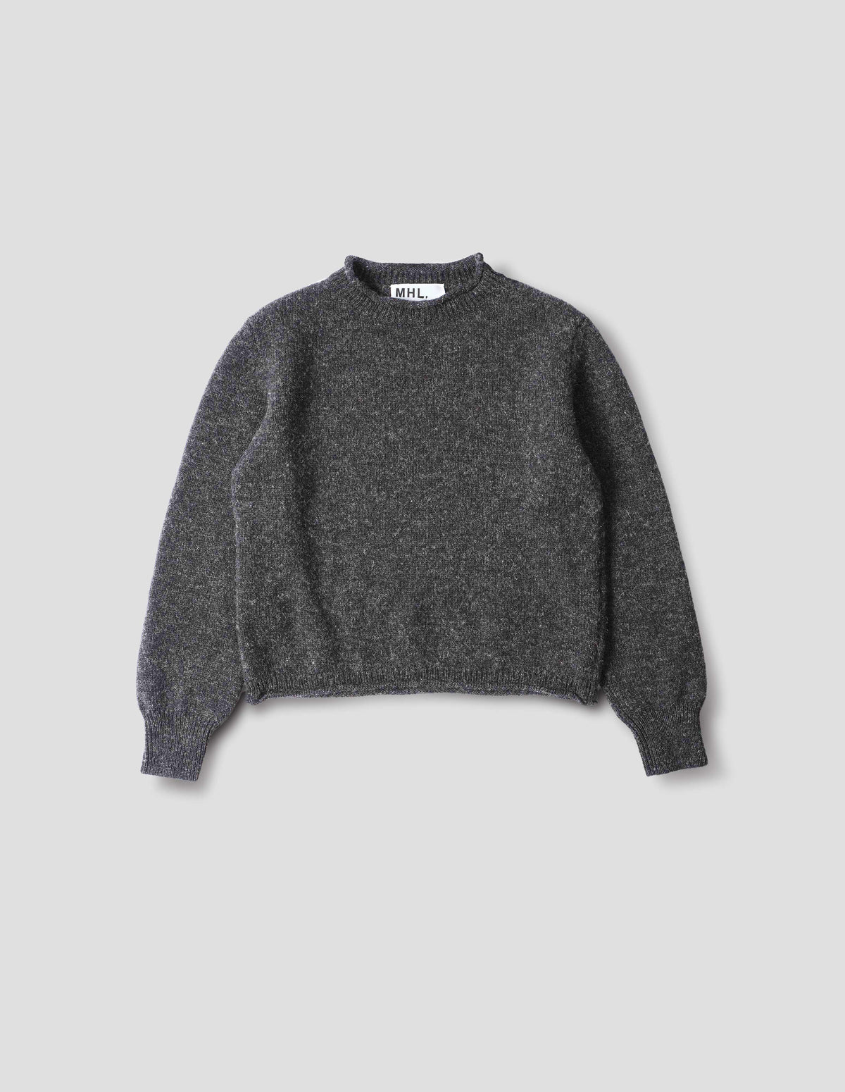 Dark grey wool crew neck jumper with a rolled edge on neck and hem, rib detailing on cuffs. Front flat lay view. 