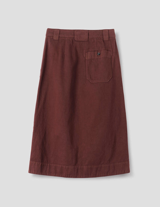 Red A line skirt with side splits, belt loop detail on back and back patch pocket with reinforced stitch detailing. Back flat lay view. 