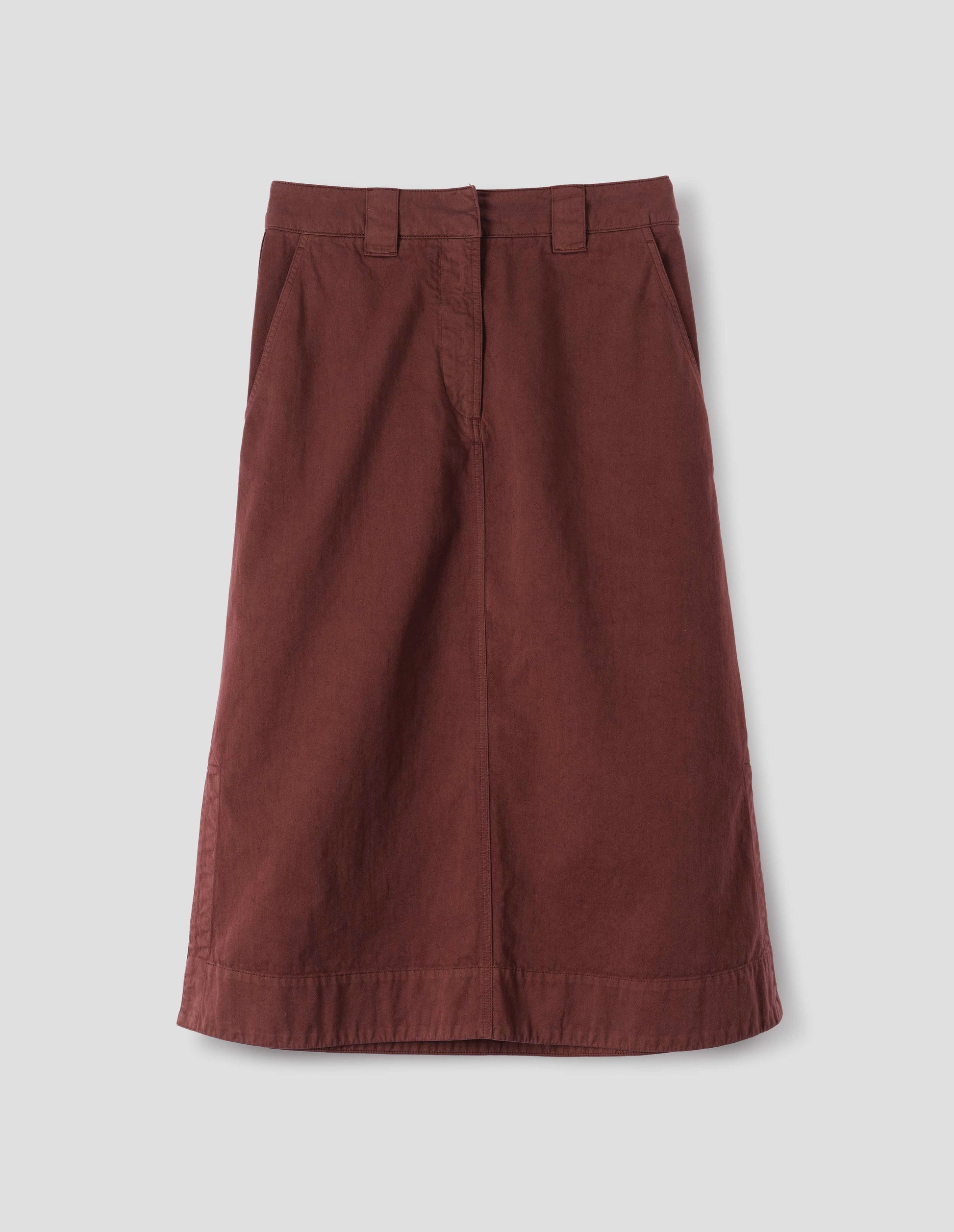 Red A line skirt with side splits, double hook and bar fastening waistband, belt loops and slant pockets. Front flat lay view.