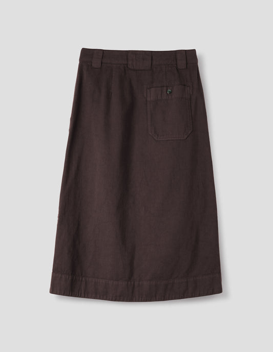 Dark brown A line skirt with side splits, belt loop detail on back and back patch pocket with reinforced stitch detailing. Back flat lay view. 