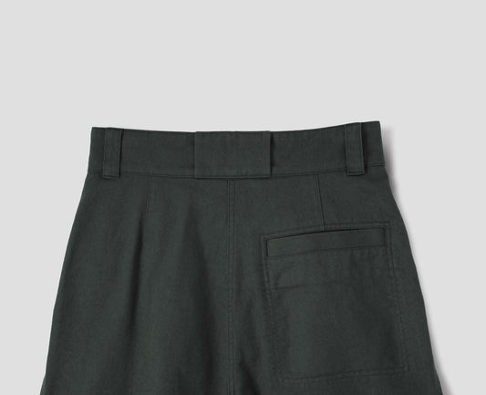 Greyish green cotton high waisted trousers with a stitch-through back welt pocket, back flat lay view.