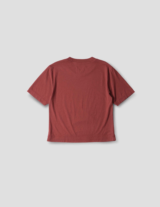 Red boxy cotton linen short sleeve t shirt with vent split hem. Back flat lay view.