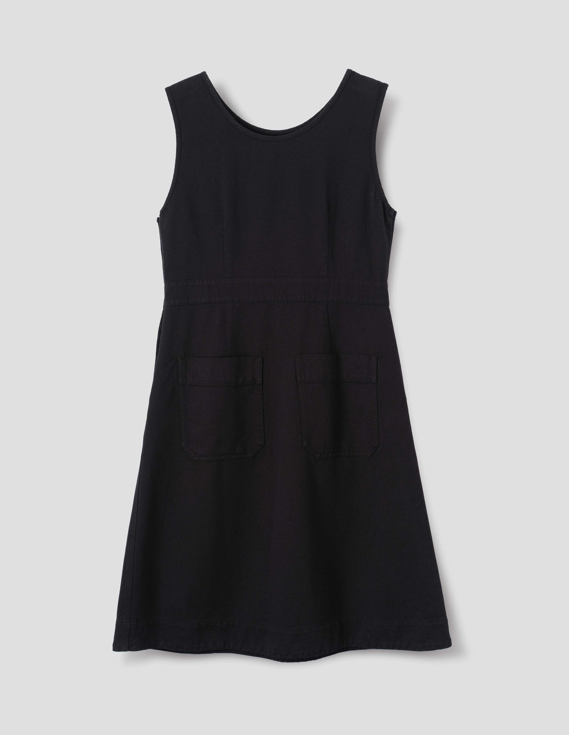 Black cotton dress, with two back patch pockets, back flat lay view.