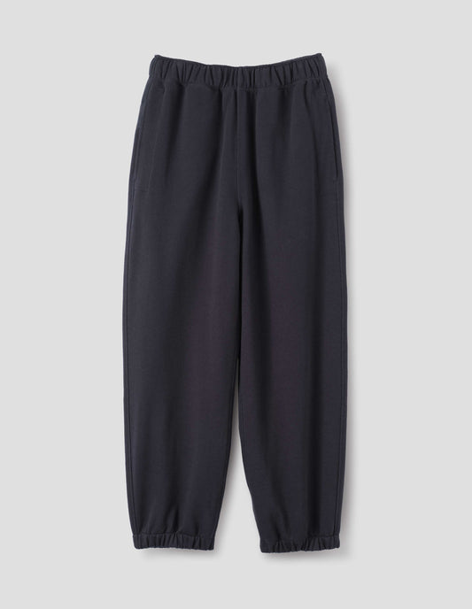 Dark navy lightweight jogger style trousers with side pockets and elasticated waistband and hem, front flat lay view.