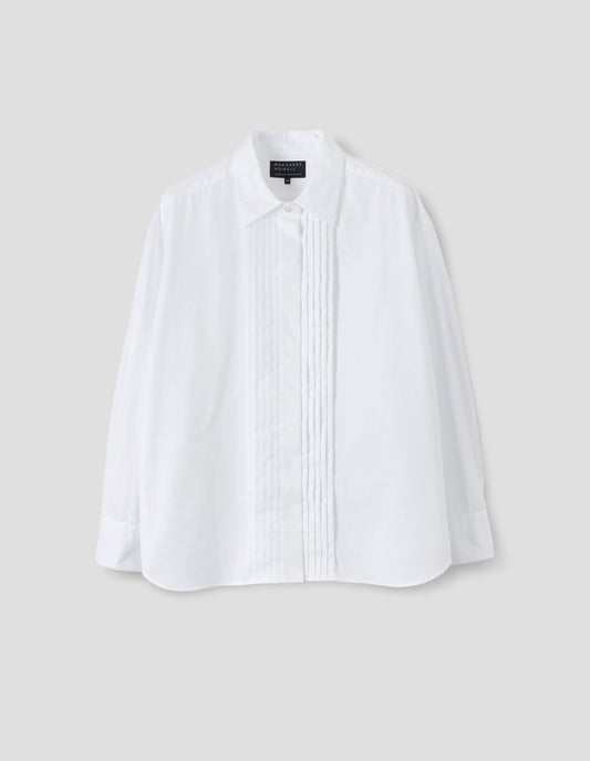 White cotton shirt with mother of pearl button closure, concealed placket and pin tuck detailing at front, and with curved hem. Front flat lay view.
