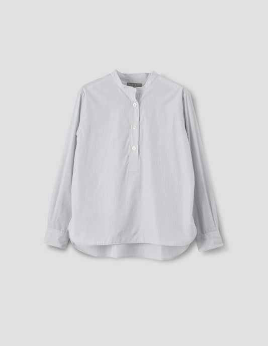 White collarless cotton shirt with dark blue stripes, mother of pearl buttons on placket with box stitch detailing and curved stepped hem. Front flat lay view.