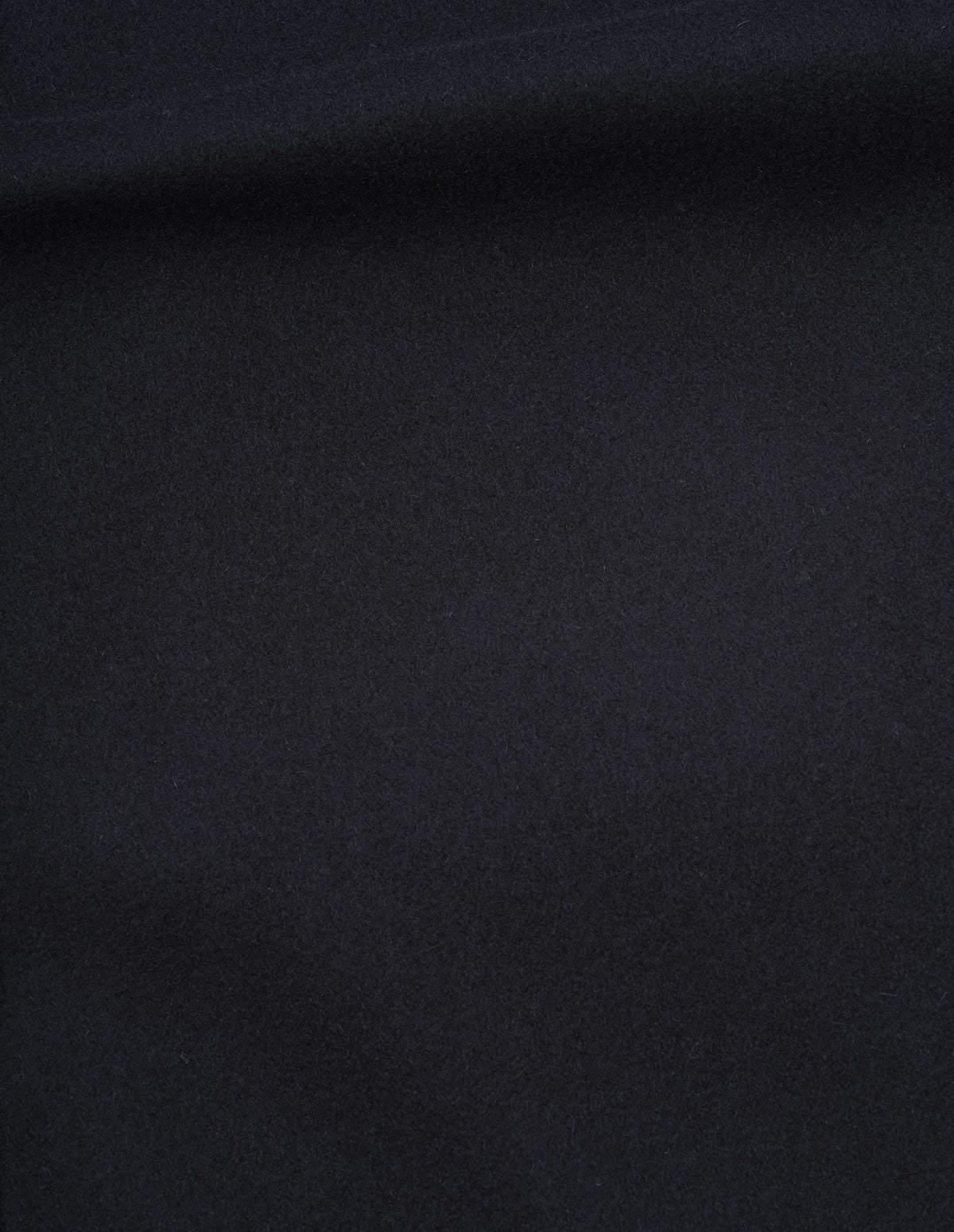 Dark blue felted wool melton coat fabric swatch.