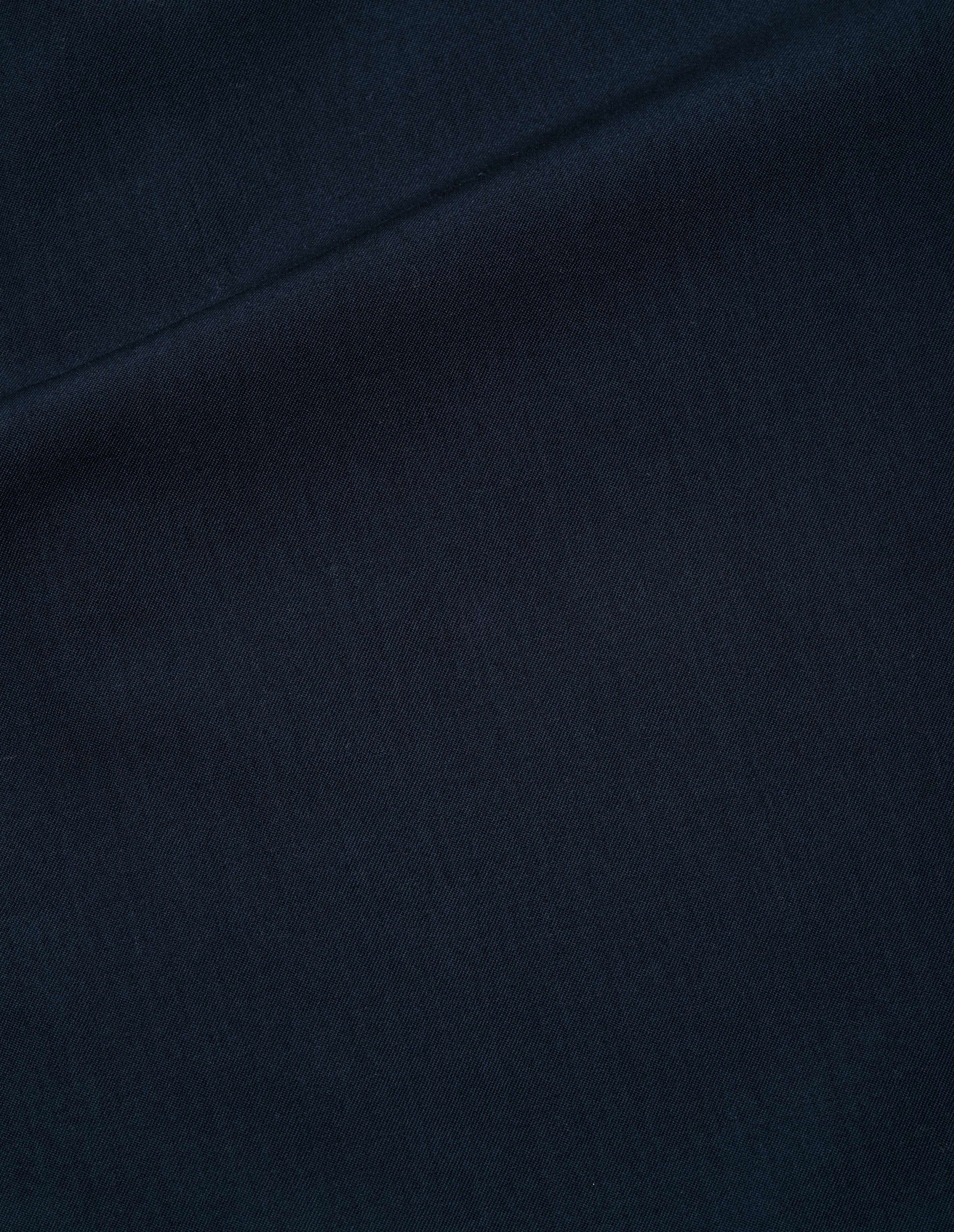 Dark blue brushed fluid wool twill trousers fabric swatch.