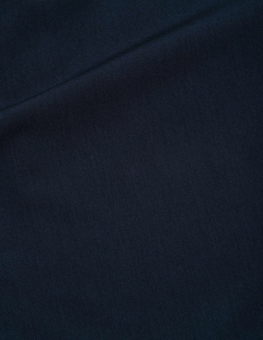 Dark blue brushed fluid wool twill trousers fabric swatch.