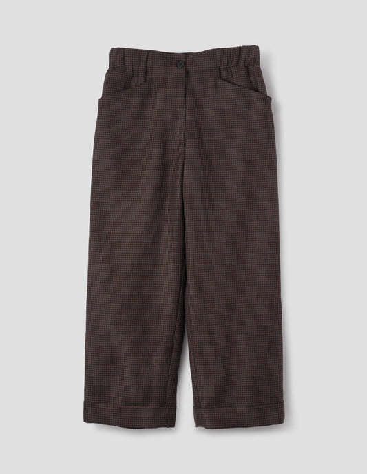 Dark blue and dark brown linen wool gingham trousers with zip fly with horn button fastening on elasticated waistband, frog pockets and stitch-down turn-up hem. Front flat lay view.