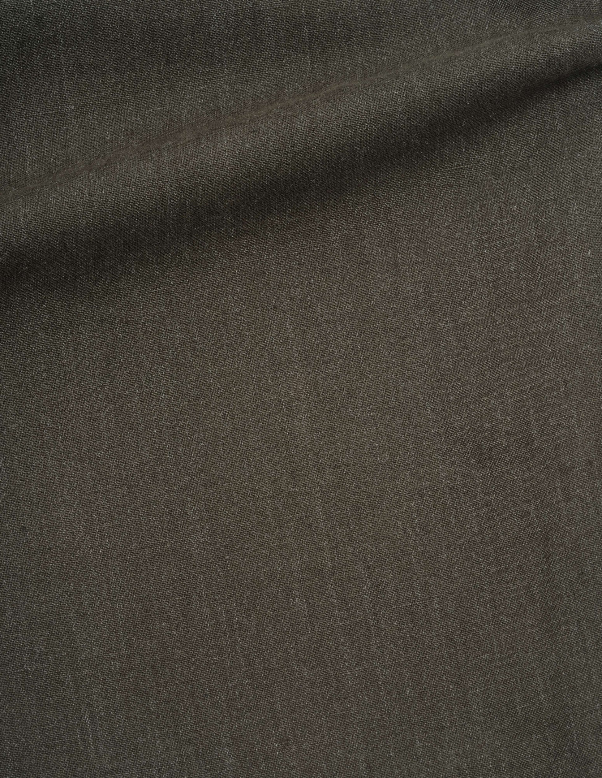 Dark green pure linen trousers fabric swatch.