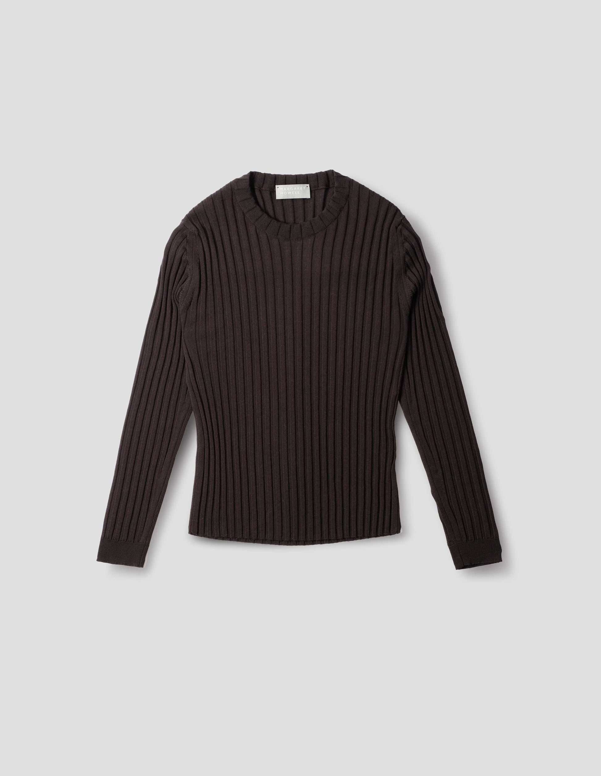 Dark brown merino top with wide rib through body, wide contrast rib on crew neck, and set-in long sleeves with fine rib cuffs. Front flat lay view. 